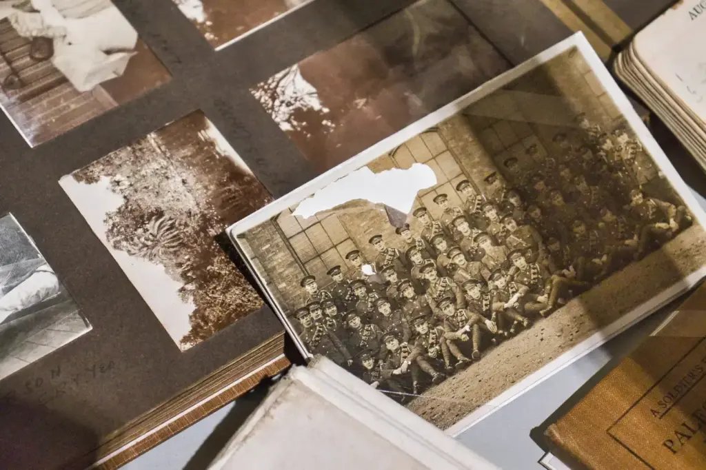A captivating vintage army photo in a sepia-toned album captures historic uniforms and nostalgia