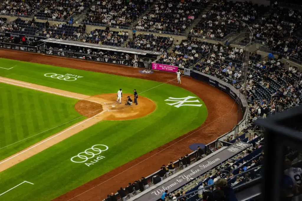 Aerial view of a baseball game at Yankee Stadium with a packed crowd