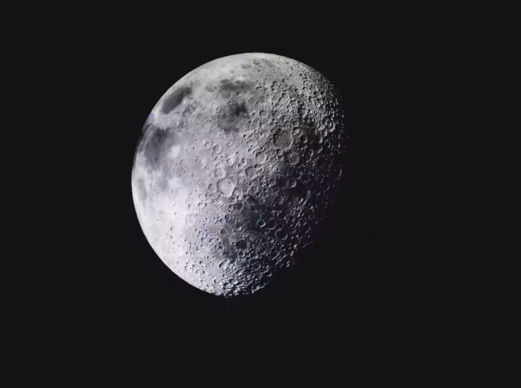 Captivating image of the lunar surface with visible craters against a deep dark sky