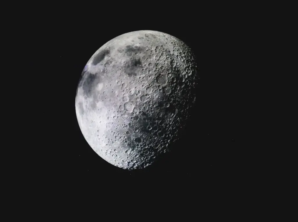 Captivating image of the lunar surface with visible craters against a deep dark sky