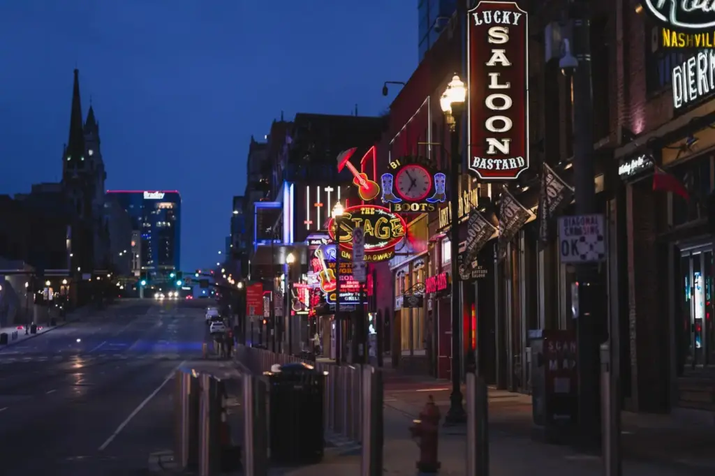 Explore neon-lit Nashville's Broadway street, a hub for nightlife and iconic bars