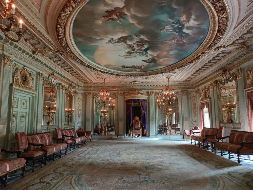 Lavishly decorated interior of a classic palace in Mumbai with ornate ceilings and chandeliers