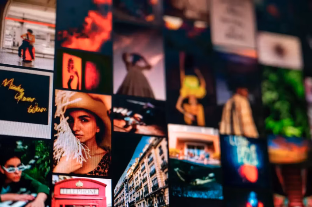 Various images of elegant people and building facade near creative titles hanging on wall in apartment as symbol of…